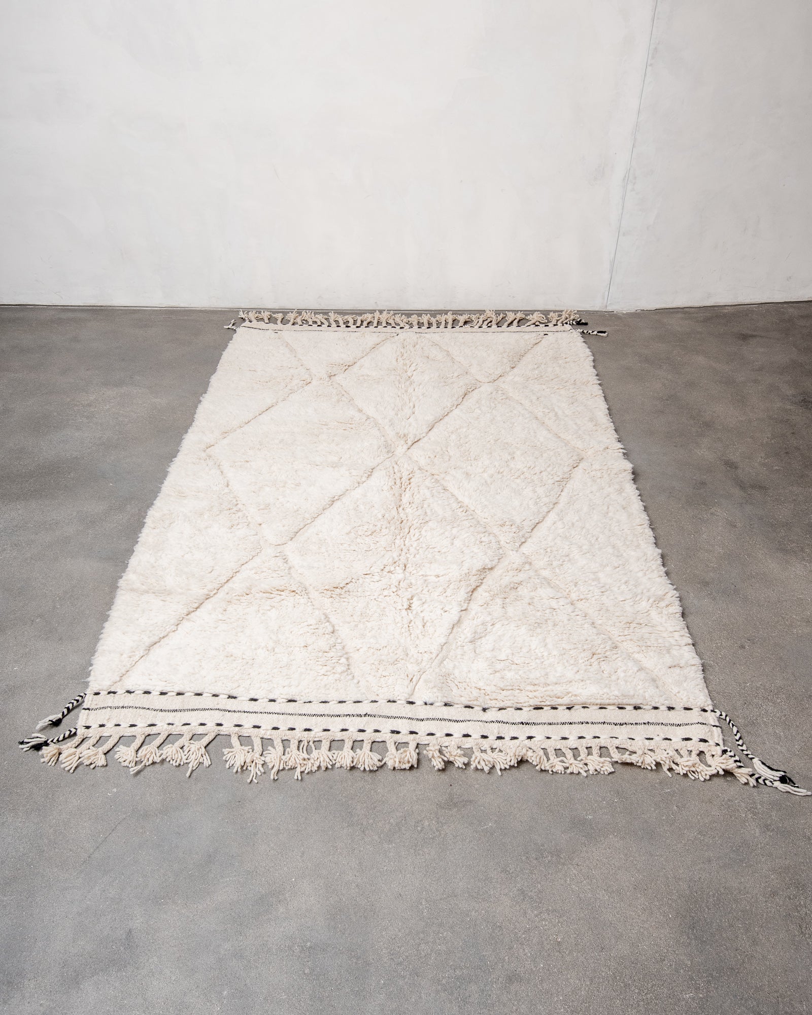 Modern, designer, handcrafted Berber rug from Morocco. Beniourain carpet with minimalist design, natural wool pile and a fluffy texture.